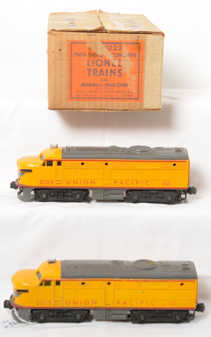 Lionel No. 2023 Union Pacific twin diesel Alcos in OB: Postwar Lionel O gauge No. 2023 Union Pacific Twin Diesel Locomotive A units in original box with inserts, C7 with perfectly clean battery compartment. Box has punctures, clear and masking tape, and s