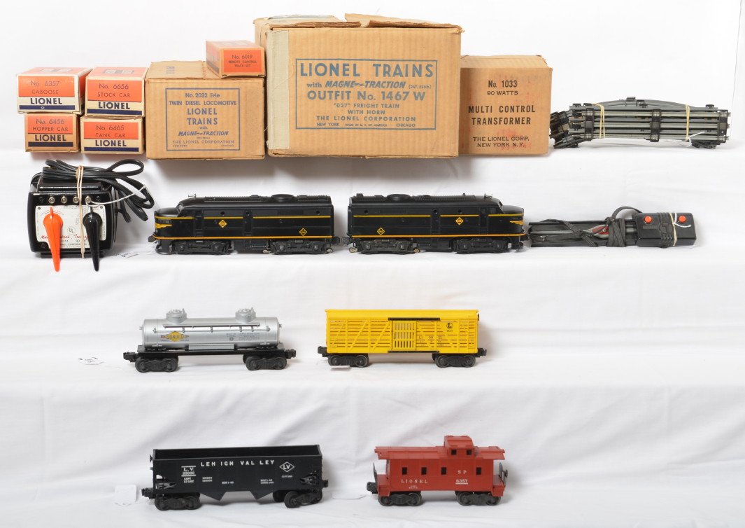 Boxed Lionel No. 1467W freight train with horn, 2032: Postwar Lionel O gauge No. 1467W Freight Train set with horn in original boxes. Set is comprised of: 2032 Erie twin Alco diesel locomotives, 6456 LV hopper, 6656 stock car, 6465 Sunoco tank, 6357 SP t