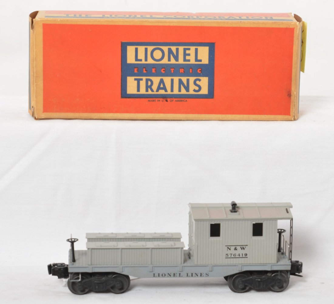 Lionel 6419-100 N&W work caboose in OB: Postwar Lionel O gauge 6419-100 N&W work caboose in original box, unrun C7-8. Train might polish to look better. Box has small tear to a tuck flap fold. Box is very square and solid with no missing fl