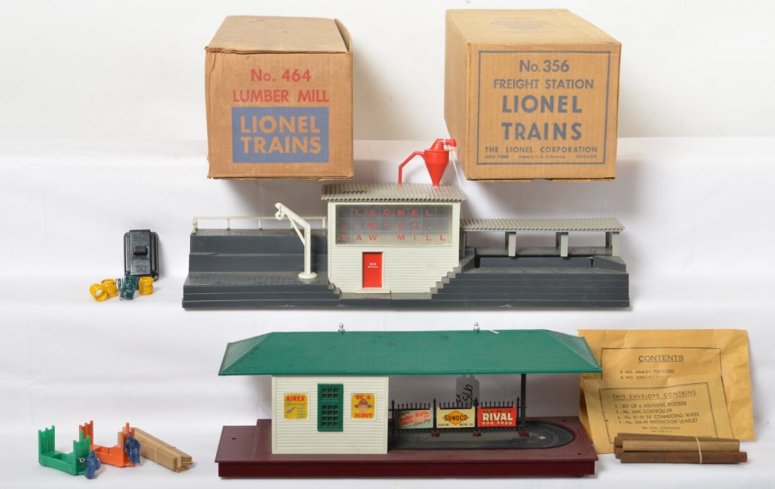 Lionel 356 freight station and 464 lumber mill in OB: Postwar Lionel O gauge 356 freight station with envelope, wire coils, freight trucks; and 464 lumber mill with envelope, logs, timbers, wire coils, silver fished inspection slip, and 364C control swit