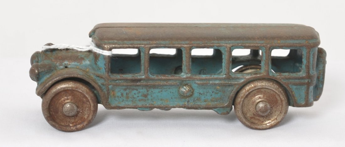 Cast Iron touring bus, passenger bus steel wheels 5î: Cast iron school, touring, and or passenger bus with steel wheels, approximately 5 inches long. Appears to be in original paint. Unmarked.