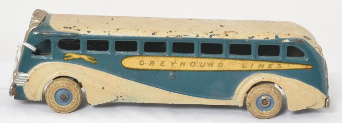 Arcade cast iron Greyhound Lines Bus 438 8-7/8î: Cast iron Arcade Greyhound Lines passenger bus 438, 8-7/8 inches long. Light shrink cracks in rubber tires. Appears to be in original paint.