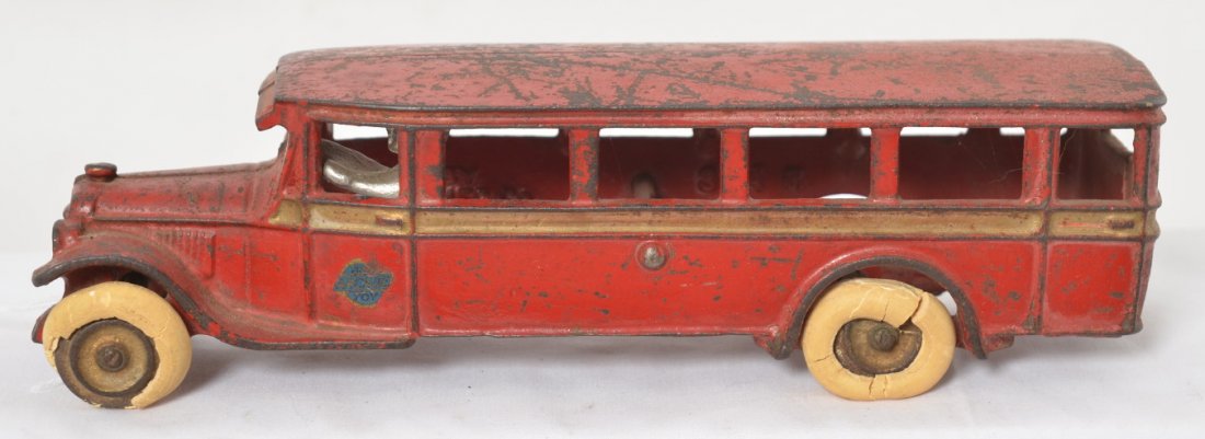 Arcade cast iron 314 travel/touring bus w/rubber tires: Cast iron Arcade 314 travel/city/touring bus with driver and rubber tires, 9-3/8 inches long. Tires have disintegration. Bus appears to be in original paint.