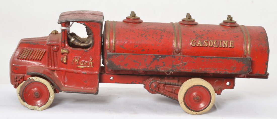 Cast iron Arcade Mack Gasoline truck 13 inches long: Cast iron Arcade Mack Gasoline truck, 13 inches long with driver and rubber tires. Tires have some disintegration. Appears to be original paint.