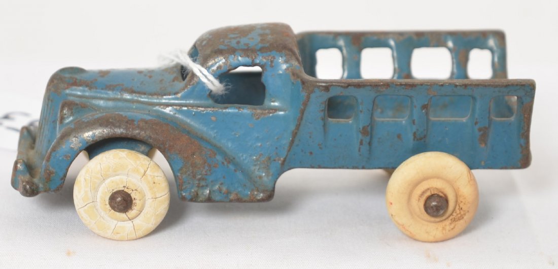 Arcade 150 2? stack side cast iron truck 4-1/8î long: Arcade cast iron stake side bed truck in original paint, 4-1/8 inches long. Truck may have 150 2 mold numbers.