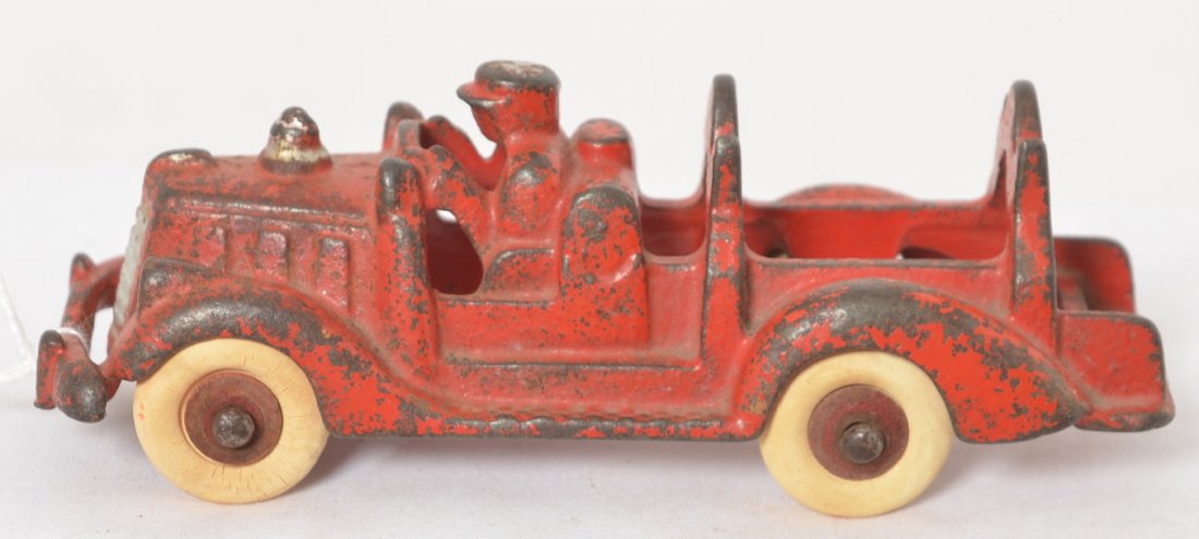Hubley Cast iron Fire Department Ladder Truck 5 inches: Hubley cast iron ladder fire department truck, no ladders. Approximately 5 inches long. Tires have some flat spotting and some super tight hairlines in some.