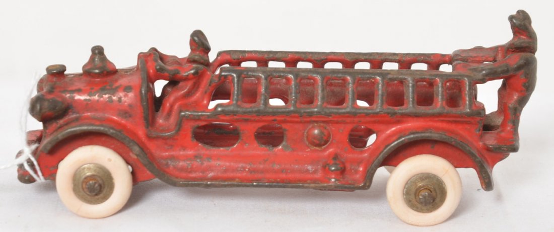 Cast Iron Fire Department Ladder Truck, 5-1/4: Cast Iron Fire Department Ladder Truck, approximately 5-1/4 inches long. Tires look reproduction, marked USA.