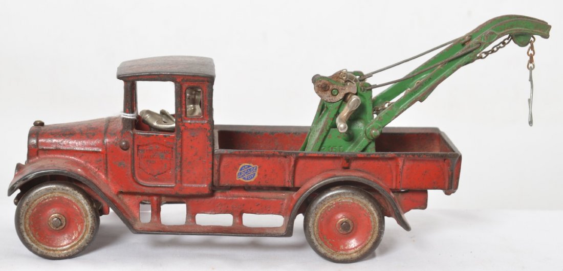 Arcade C.I. International Harvester Truck wrecker No. 2: Arcade cast iron No. 2 International Harvester Truck, wrecker with Weaver boom. Truck appears to be completely original, except decals. Truck measures approximately 12-1/2 inches long.