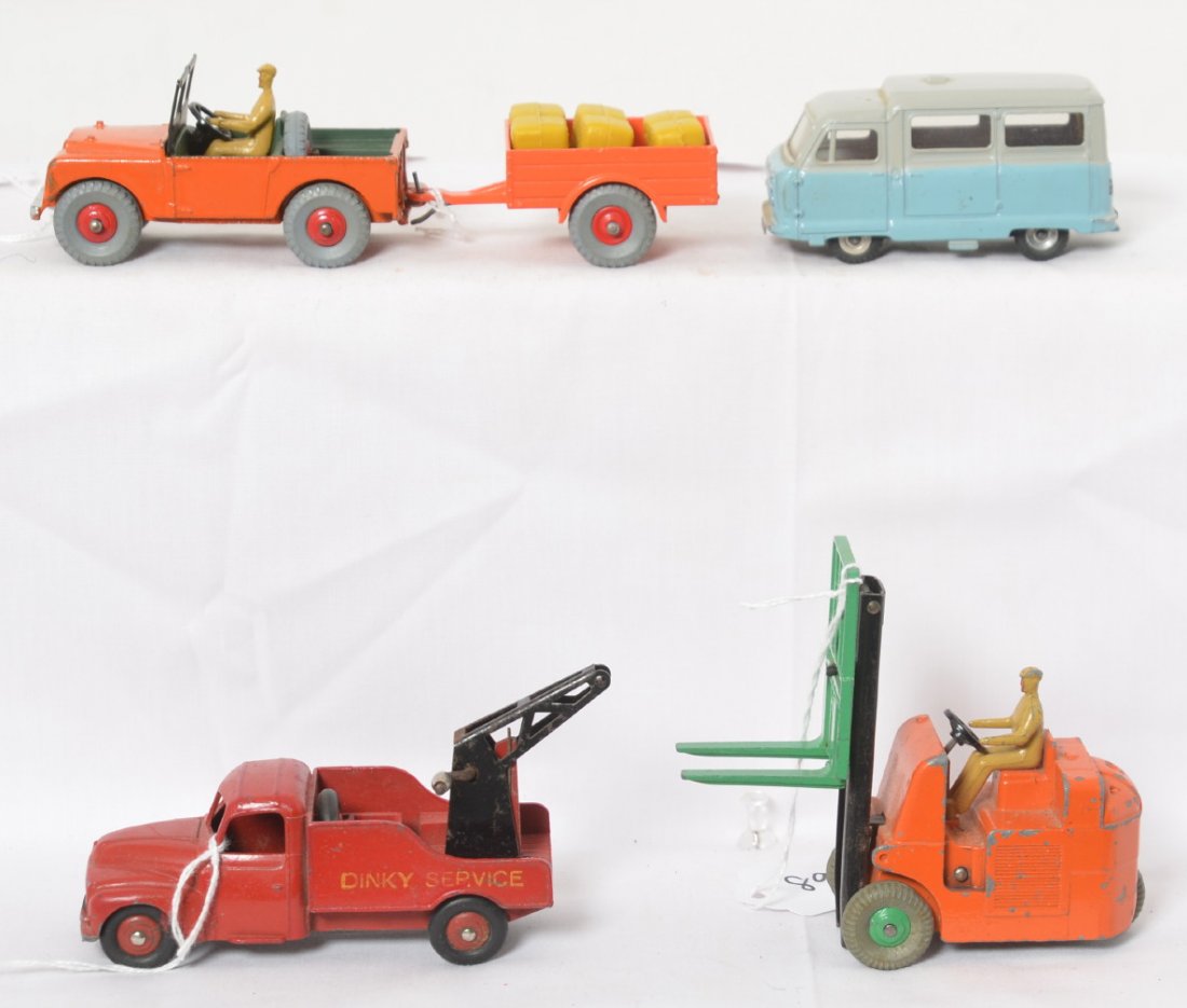 Dinky Toys 340/341, 35A, 295, and 14C: Dinky Toys diecast vehicles, 340/341 Land Rover with trailer, 35A Citroen ñ23î Dinky Service wrecker, 295 Standard Atlas, and 14C Coventry Climax lift. All appear to be in original paint, with origi