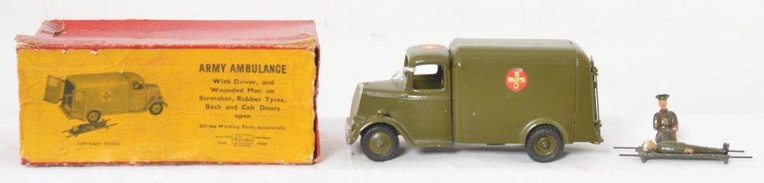 Britains Army Ambulance w/driver, wounded man,,, in OB: Britains Army Ambulance with driver, wounded man on stretcher, rubber tyres, back and cab doors open, in original box. Some small spots of oxidation and , otherwise little wear. Box lid is missing end