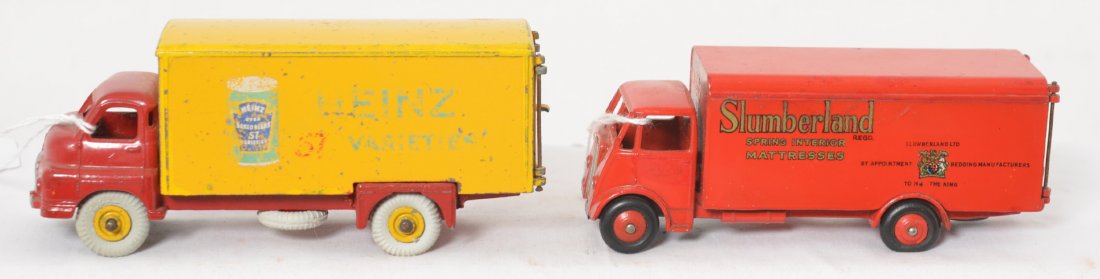 Dinky Supertoys Slumberland and Heinz bean can: Dinky Supertoys diecast delivery trucks, Guy Slumberland and Big Bedford Heinz 57 Varieties bean can. Heinz has repro tires and Slumberland has touchups to red.