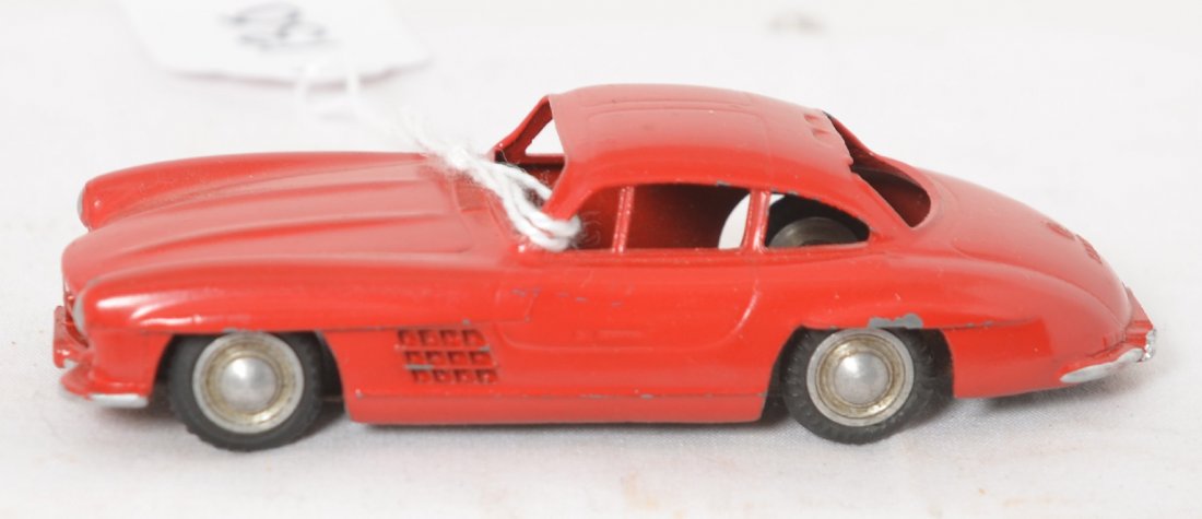 Marklin 8019 Mercedes Benz 300SL diecast car in red: Marklin 8019 Mercedes Benz 300SL diecast toy car in red, appears to be original paint and tires. Approximately 93mm long