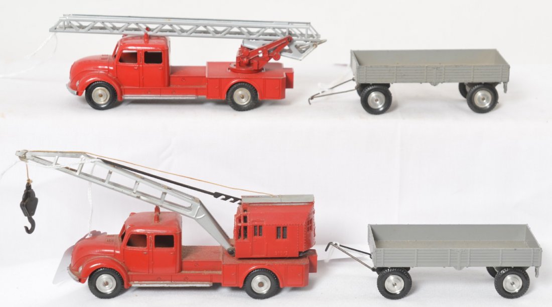 Marklin 8023, 8031, 8012, 8012: Marklin diecast toy vehicles, 8021 aerial fire truck, 8031 crane truck, and two 8012 wagons. All appear to be in original condition. 8031 measures approximately 6-1/8 inches long.