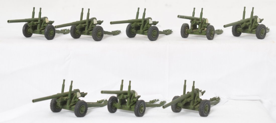Eight Dinky Toys 692 55mm Medium Guns: Dinky Toys diecast military toys, eight 692 55mm Medium Guns. Guns appear to be in original condition with original tires and paint. One has play wear and a little dirt. Rest are clean and show little