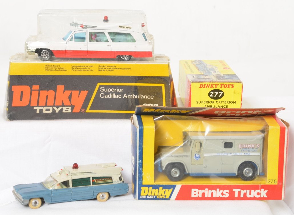 Dinky Toys 277, 275, and 288 vehicles in package: Dinky Toys diecast toy vehicles, 277 Superior Criterion Ambulance with flashing light, 275 Brinks Truck, and 288 Superior Cadillac Ambulance, in original packages. 277 shows little wear, clean battery