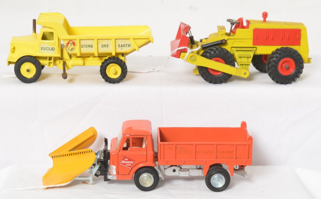 Dinky Supertoys 976, 965, and Ford D 800 construction: Dinky Supertoys diecast construction toys, 976 Michigan tractor dozer 180-111, 965 Euclid rear dump truck, and Ford D 800 dump truck. Vehicles have repainting, missing pieces, split tires, etc. This g