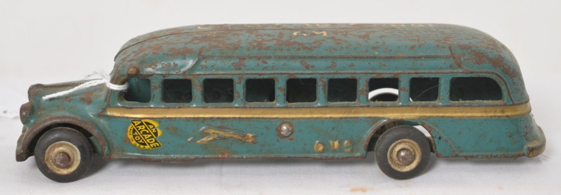 Arcade Greyhound Coast to Coast GMC bus: Cast iron Arcade Greyhound Coast to Coast GMC travel/touring bus in original condition with original paint, decal, and parts. Bus measures approximately 7-5/8 inches long. Tires donÍt have flats or s