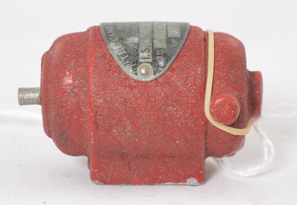 The Lamb Electric Co. electric motor paperweight: The Lamb Electric Co., Kent, OH electric motor paperweight salesman sample, measures approximately 2-1/4 inches long.