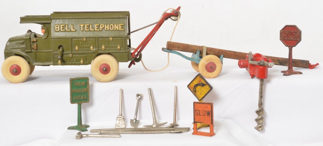 Hubley Bell Telephone truck w/trailer, drill, tools,: Cast iron Bell Telephone truck and trailer with drill, hand tools, and signs. Truck may or may not be older repaint, rest looks to be original paint. Truck measures approximately 12-1/2 inches long.