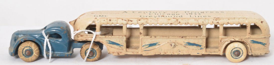 1933 Arcade GMC A Century of Progress Greyhound: Cast iron 1933 Arcade GMC A Century of Progress Chicago Greyhound Lines semi tractor and tour/passenger bus toy. Appears to be in original condition with original paint, decals, parts,and tires. Some