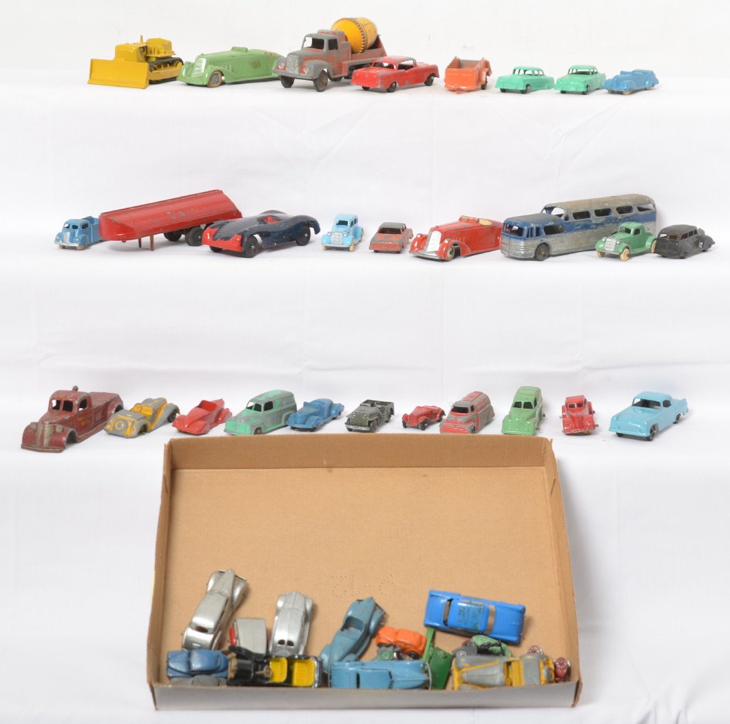 Fifty various Tootsietoy diecast lead vehicles: Fifty various Tootsietoy diecast lead vehicles, trucks, U-Haul trailer, cement mixer, tow truck, cars, coupes, sedans, bulldozer, Porsche, Thunderbird, Cord, panel deliveries, boats, tank, Greyhound b