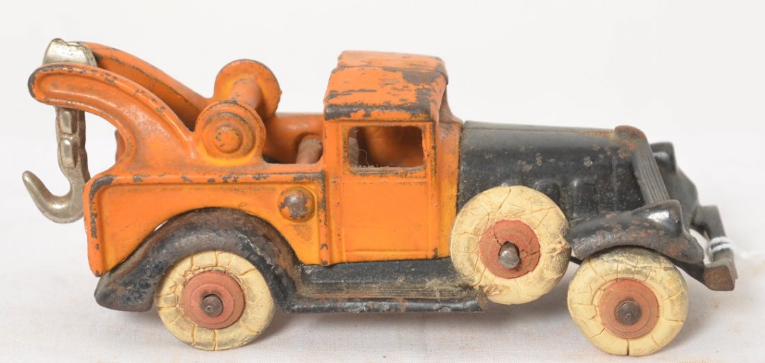 Hubley A.C. Williams piano wire Take-Apart tow truck: Hubley A.C. Williams piano wire Take-Apart tow truck, cast iron with Pat. number and casting numbers. Original paint and tires. Truck measures approximately 5-1/4 inches long.