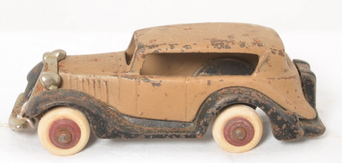 Cast iron Sedan with boot Pat. Pend. 4-3/8 long: Cast iron Sedan Automobile with Pat. Pend. and casting numbers, original paint. Tires are old repro. Approximately 4-3/8 inches long.