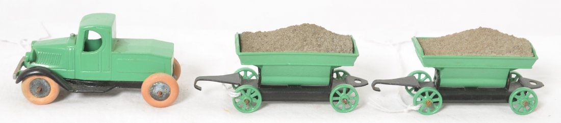 Tootsietoy Mack truck with two side dump hoppers: Tootsietoy diecast lead Mack truck with two side dump ore cars/hoppers. All have been repainted/restored.