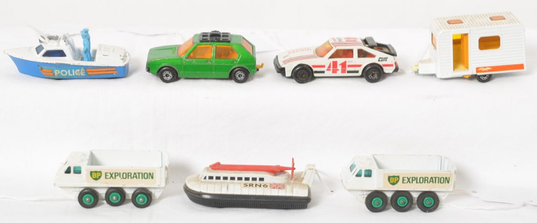 Nine diecast Matchbox by Lesney car, boat, hovercraft,: Nine diecast toy Matchbox by Lesney vehicles, No. 31 Caravan, 7 VW Golf, 52 Police Launch, 72 SRN6 Hovercraft, two 61 Alvis Stalwart, and Toyota Supra 1982 1:60. Very little to very light wear, origin