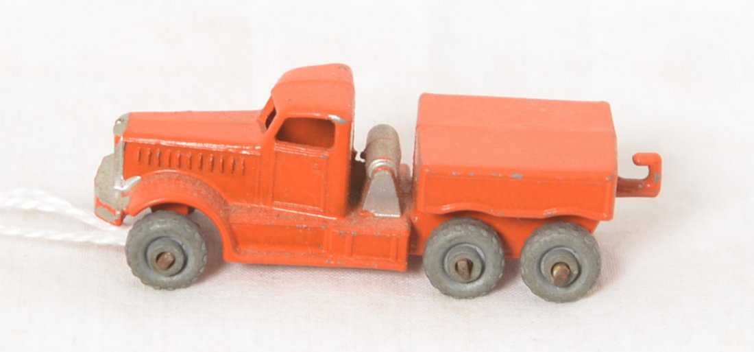 Lesney England cable operated dump truck? OO: Diecast toy truck marked Lesney England, resembles a cable operated dump truck with tandem axles and tow hitch. Looks new showing no wear. Original paint and wheels. Measures approximately 55mm long.