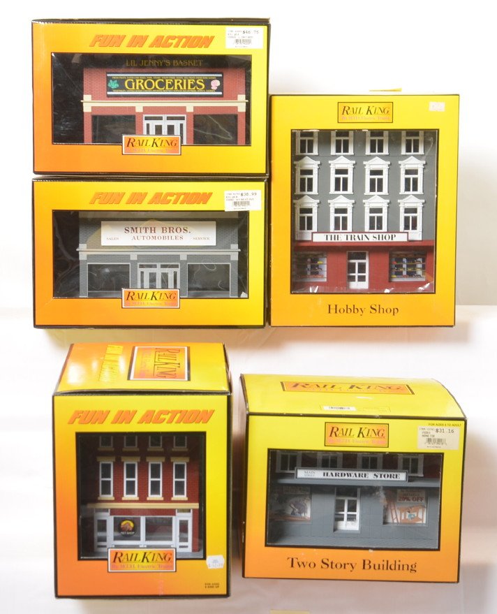 5 Railking buildings pet store, auto dealership,: MTH Railking modern O gauge buildings in OBs. Five buildings include 90021 Smith Brothers auto dealership, 9004 Railtown Hobby Shop. 90121 pet store, 9018 hardware store, and 90200 grocery store. Item