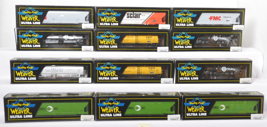 12 Weaver tank cars and center flow hoppers: Weaver modern O gauge freight cars in OBs. Twelve cars total including U1330L Staley tank car, U1331LD Corn Products tank car, U1330L Staley tank car, U4519L Firestone tank car, U1728LD Cargill hopper