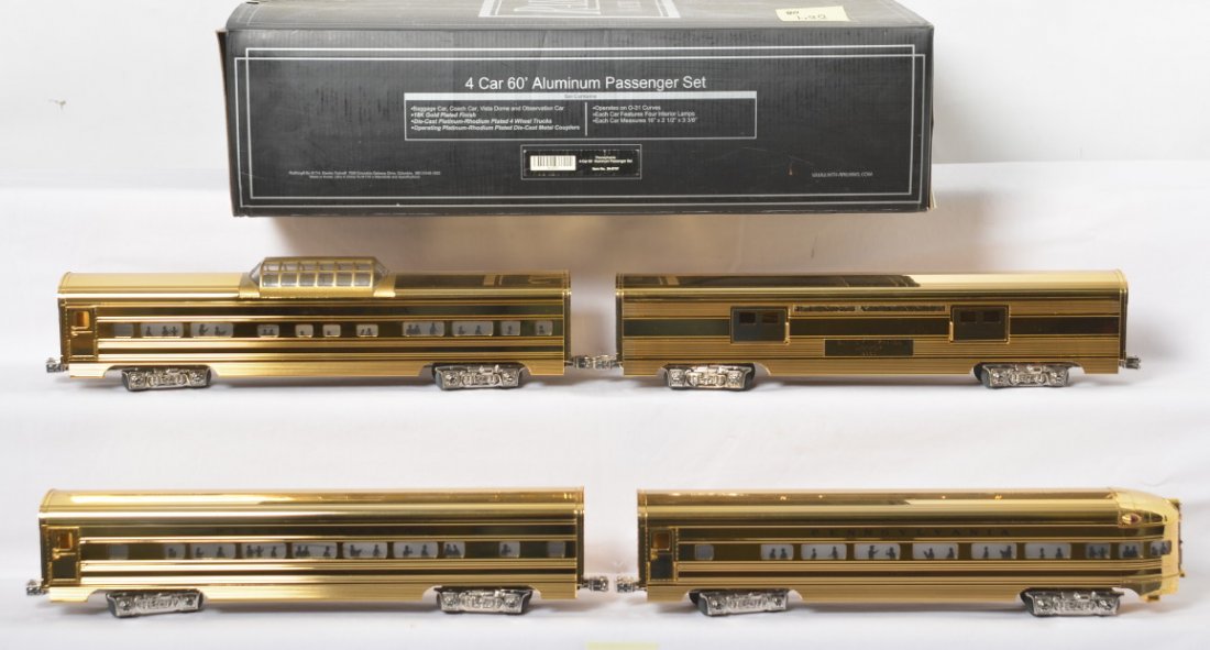 Railking Millennium Pennsylvania gold passenger set: MTH Railking modern O gauge Pennsylvania 30-6707 four car gold plated passenger set in OB. Passenger set includes 2000 EA baggage, J. Lionel Cowen coach, Harry Ives Vista Dome, and A.C. Gilbert observ