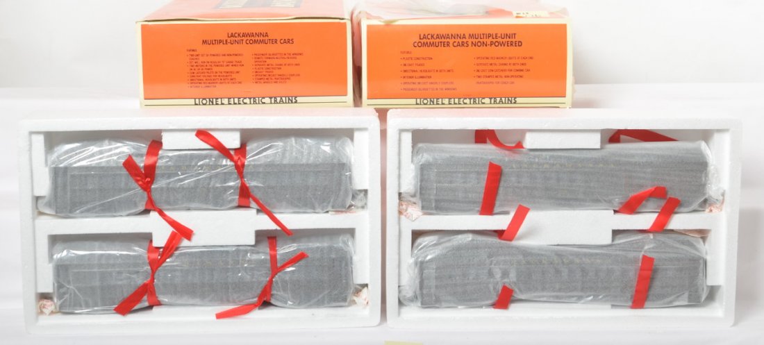 Lionel Lackawanna MU sets 18304 18305: Lionel modern O Gauge Lackawanna commuter car sets in OBs. Includes 18304 set with powered unit and 18305 dummy set. Opened for inspection only. Cars are C10. OBs do have some corner and light shelf w