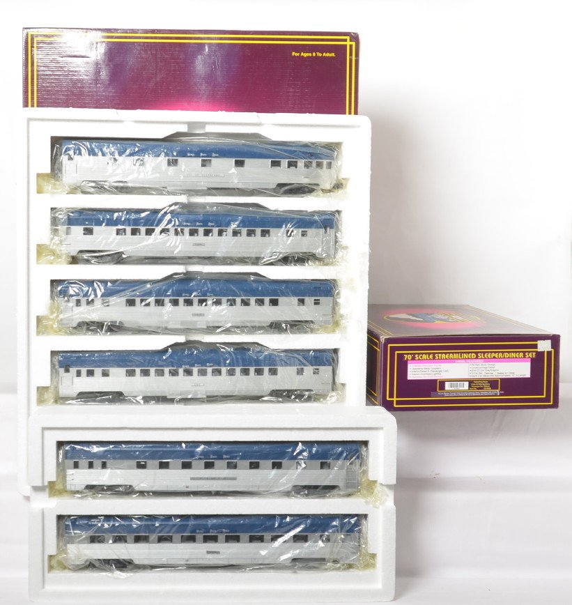 MTH Nickel Plate 7 car passenger set: MTH modern O gauge Nickel Plate passenger car set. Seven cars include 20-6526 five car set and 20-6626 two car sleeper and diner add on. Cars are C8 with run time. OBs have some light corner wear.