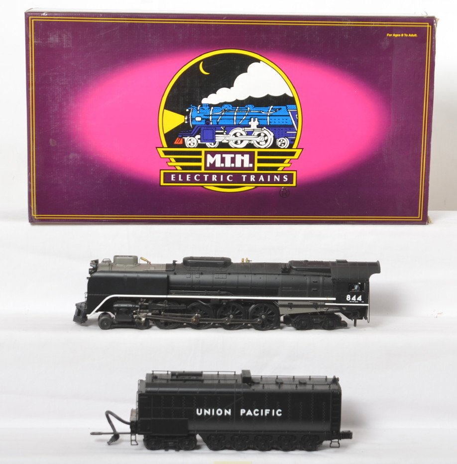 MTH Union Pacific FEF Northern with Proto 2: MTH modern O gauge 20-3044-1 Union Pacific FEF 4-8-4 Northern in OB. Loco features Protosound 2.0, DCS control, Protosmoke, Protocoupler, and more. Loco is C8 with run time and some shelf dust, howeve