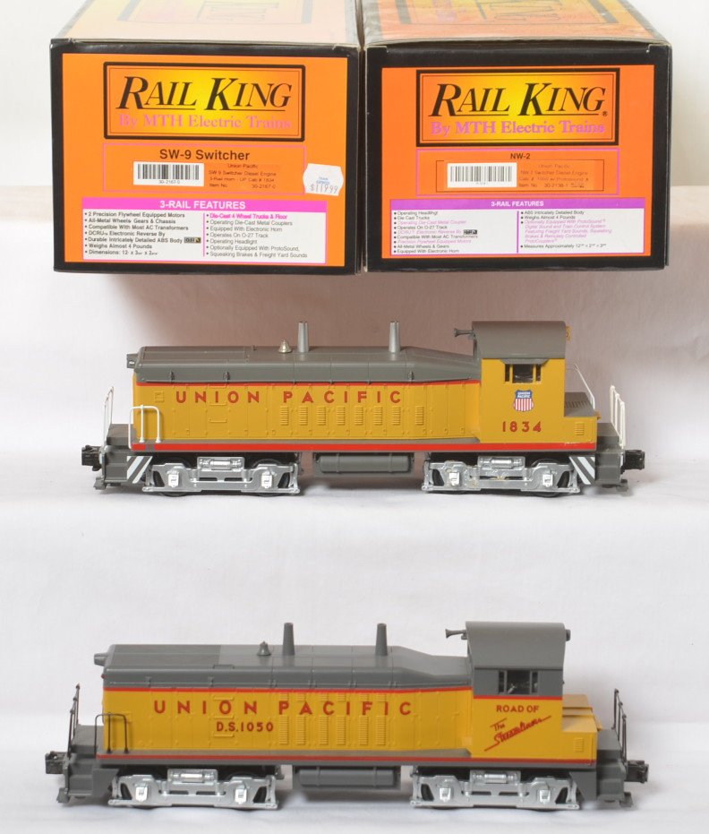 Railking Union Pacific NW-2 and SW-9 switchers: MTH Railking modern O gauge Union Pacific switchers in OBs. Includes 30-2138-1 NW-2 with Protosound and 30-2167-0 SW-9 with Locosound. Locos are generally C8, SW-9 has more moderate run time.