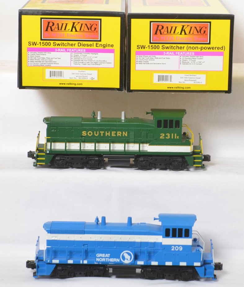 Railking SW-1500 Southern and dummy Great Northern: MTH Railking modern O gauge switchers in OBs. Includes 30-2264-0 Southern SW-1500 with Locosound and dummy 30-2263-3 Great Northern SW-1500. Powered loco is C8 with light run time.