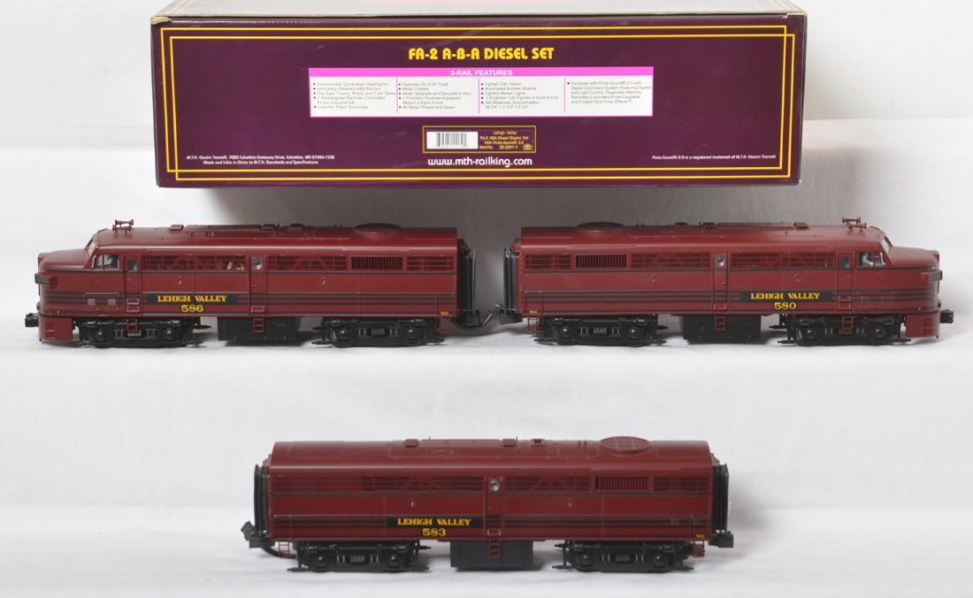MTH Lehigh Valley Alco FA-2 A-B-A with Proto 2: MTH modern O gauge 20-2241-1 Lehigh Valley Alco FA-2 A-B-A diesel locomotive set in OB. Loco features Protosound 2.0, DCS control, Protosmoke, Protocouplers, and more. Locos are C8+ with very light ru