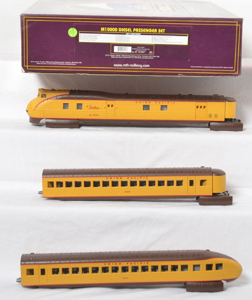 MTH Union Pacific M-10000 set with Proto 2: MTH modern O gauge Union Pacific M10000 set in OB. Catalog number is 20-2298-1. Loco features Protosound 2.0, DCS control, Protosmoke, and more. Set is C8+ with light run time and shelf dust.