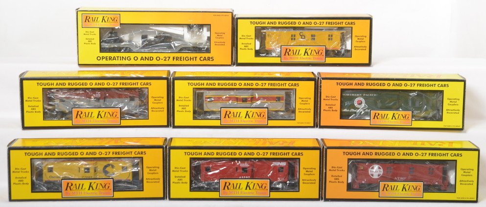8 Railking cabooses 7716, 7720, 7725, etc: MTH Railking modern O gauge freight cars in OB. Eight cars include 7711 Norfolk Southern, 7713 Chessie, 7716 Santa Fe, 7926 Conrail, 7712 New York Central, 7709 Chesapeake and Ohio, 7725 Northern Paci