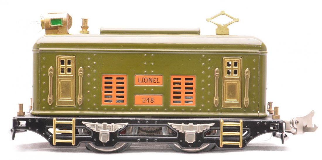 Lionel Prewar 248 Olive Green Electric Loco: Lionel prewar O gauge 248 olive green electric loco with orange inserts and brass trim. The loco has been professionally restored to look like new.