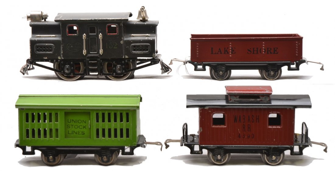 Lionel Prewar O Ga. Freight Set 152 901 802 901: Lionel prewar O gauge freight set with a 152 dark gray electric loco, 901 maroon Lake Shore gondola, 802 pea green Union Stock Lines cattle car and a 801 maroon Wabash RR caboose. The roof on the loco