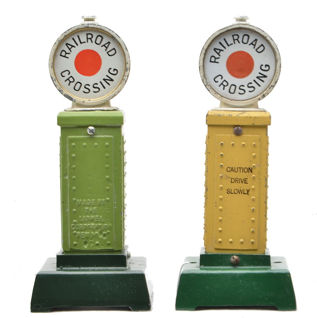 Lionel Prewar 2-87 Railroad Crossing Signals: Lionel prewar O gauge two 87 railroad crossing signals, one with dark green base, Stephen Girard green box and white head and one with dark green base, cream box and white head. The base and box on th