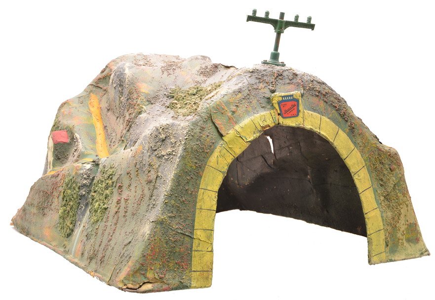 Am Flyer 4267 Papier-Mache Cascade Tunnel: American Flyer prewar wide gauge 4267 papier-mache Cascade tunnel with one telegraph pole. The tunnel has several cracks. The colors are nice.