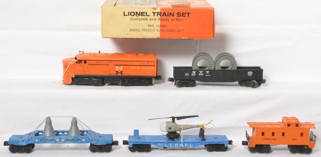 Lionel No. 11232 diesel freight with headlight set in: Postwar Lionel O gauge 11232 diesel freight with headlight set in original box with 232 New Haven diesel Alco A unit, 6413 Mercury capsule car, 3410 helicopter launching car with Navy copter, 6062 NYC