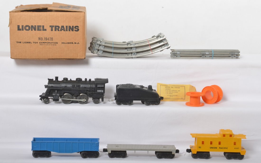 Lionel 19428 steam freight set in OB 1062, 6167: Postwar Lionel O gauge 19428 steam freight set with 1062 loco and slopeback tender, unmarked gondola, unmarked flat, 6167 Union Pacific caboose, straight and curved track. Trains look C7-8. Components