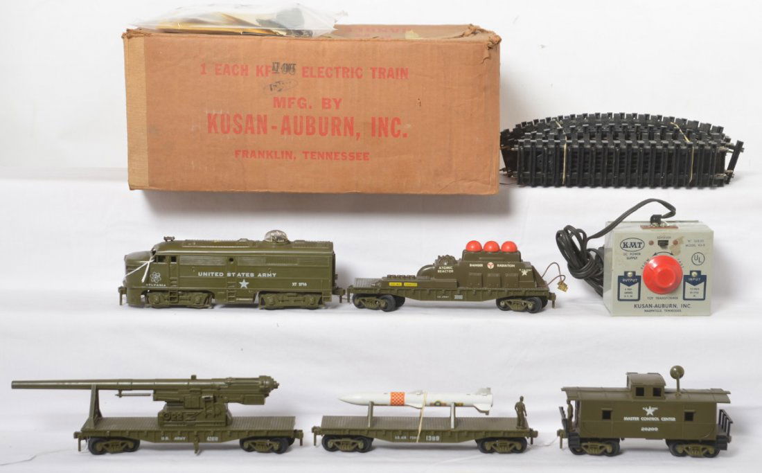 KMT KF-110 Five-Unit Atomic Train in original set box: Postwar KMT Kusan-Auburn O gauge KF-110 Five-Unit Atomic Train in original box with XT 2716 Sylvania US Army Alco diesel A unit, 30100 US Army Atomic Reactor car, 1389 U.S. Air Force missile carrying