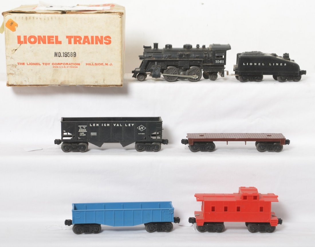 Lionel No. 19589 steam freight set in original box: Postwar Lionel O gauge 19589 steam freight set consisting of: 1061 steam locomotive and slope back tender with unnumbered LV hopper, undecorated blue gondola, unnumbered 6406 General-type flat, and un
