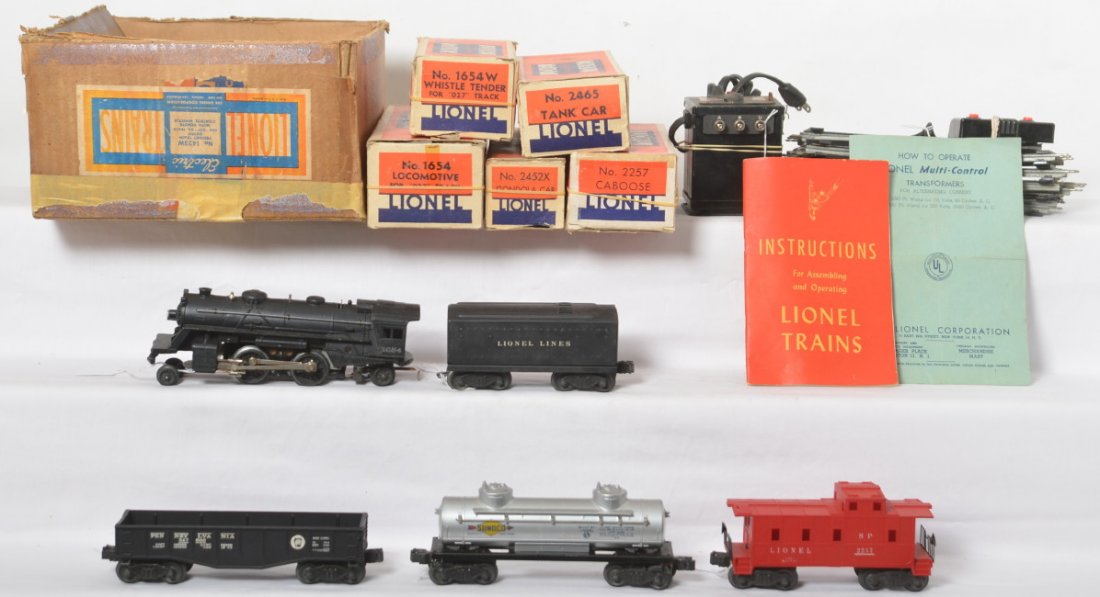 Lionel 1423W freight train outfit in original boxes,: Postwar Lionel O gauge 1423W freight train outfit with remote control whistle in original boxes consisting of: 1654 steam loco and 1654W whistle tender with 2465 Sunoco tank, 2452 Pennsylvania gondola